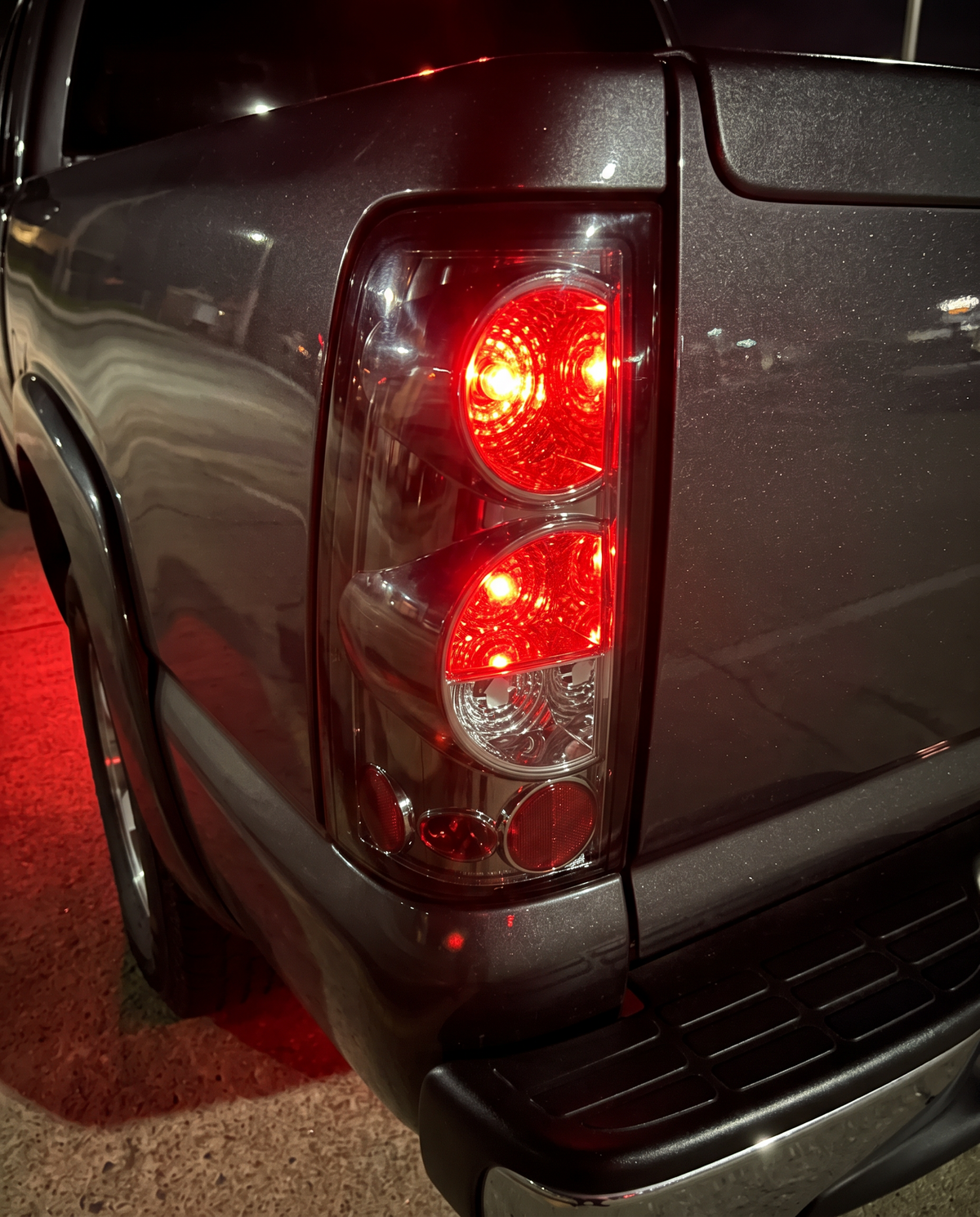 Close-up of tail light with brake lights on